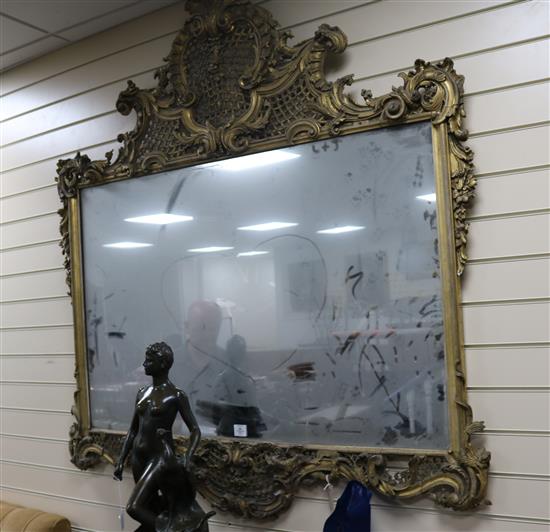 A late Victorian giltwood and gesso wall mirror, W.4ft 8in. H.5ft 1in.